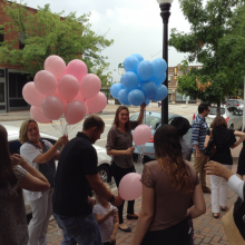 Passing out balloons to event attendees
