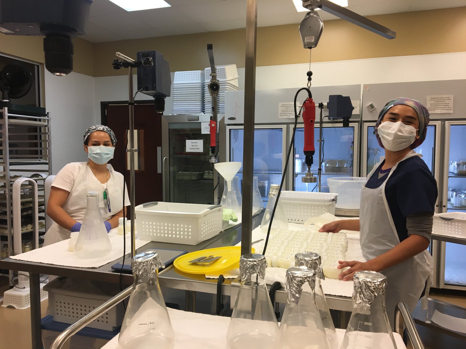 Two women working in breastmilk lab