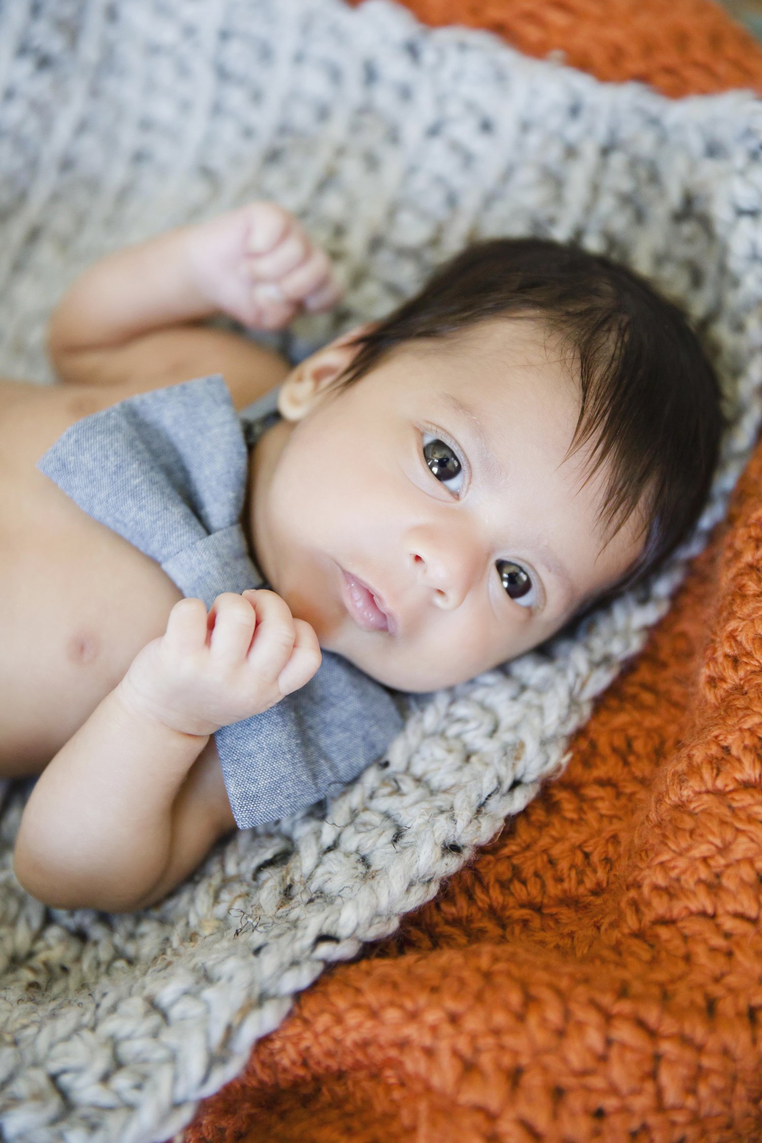 Newborn on crocheted blanket
