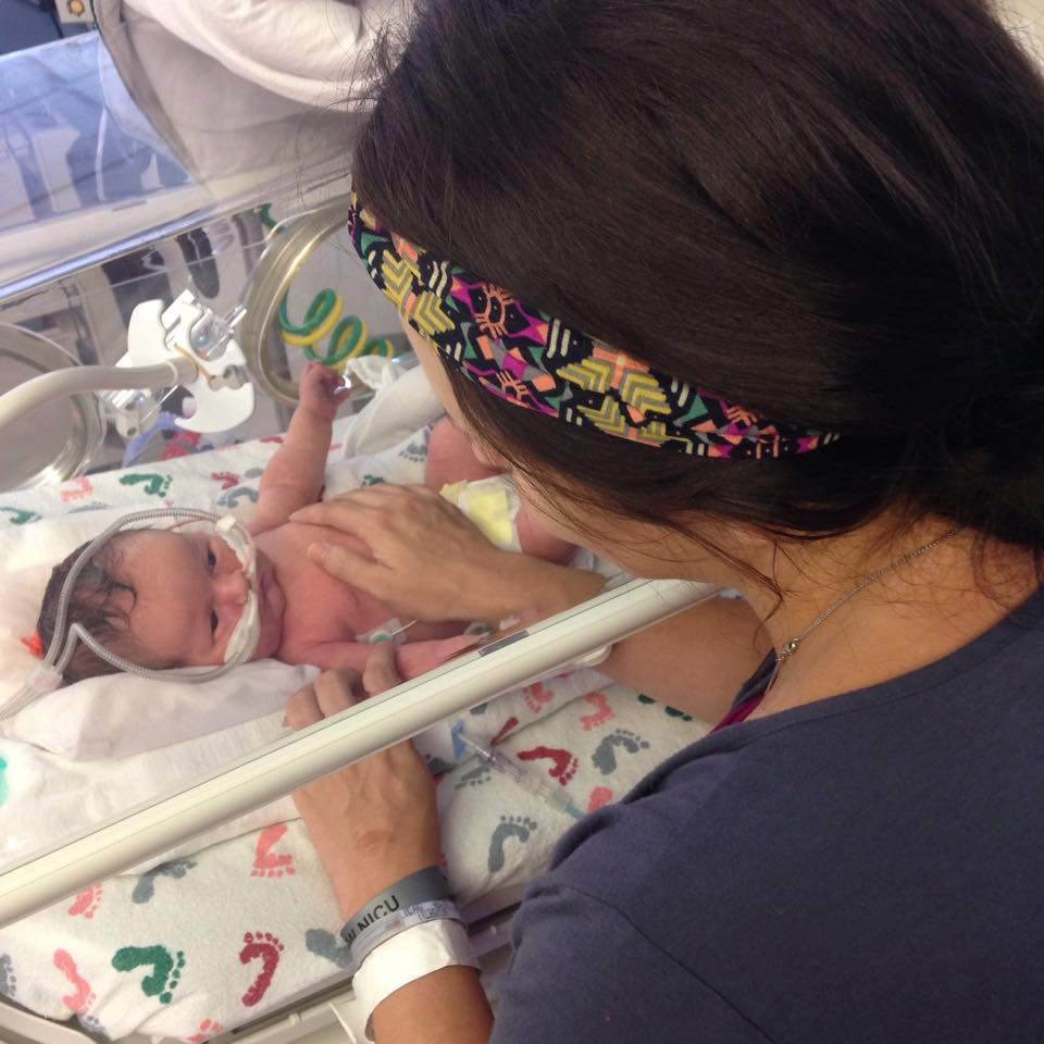 Mother with her baby in the NICU