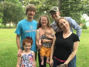 left to right: granddaughter Erowynn (7), stepson Clint (27), Mary Jennifer with Isaac, son Alton (20) and stepdaughter Megan (29)  