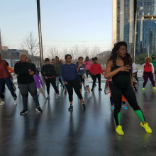 Woman leading group exercise class