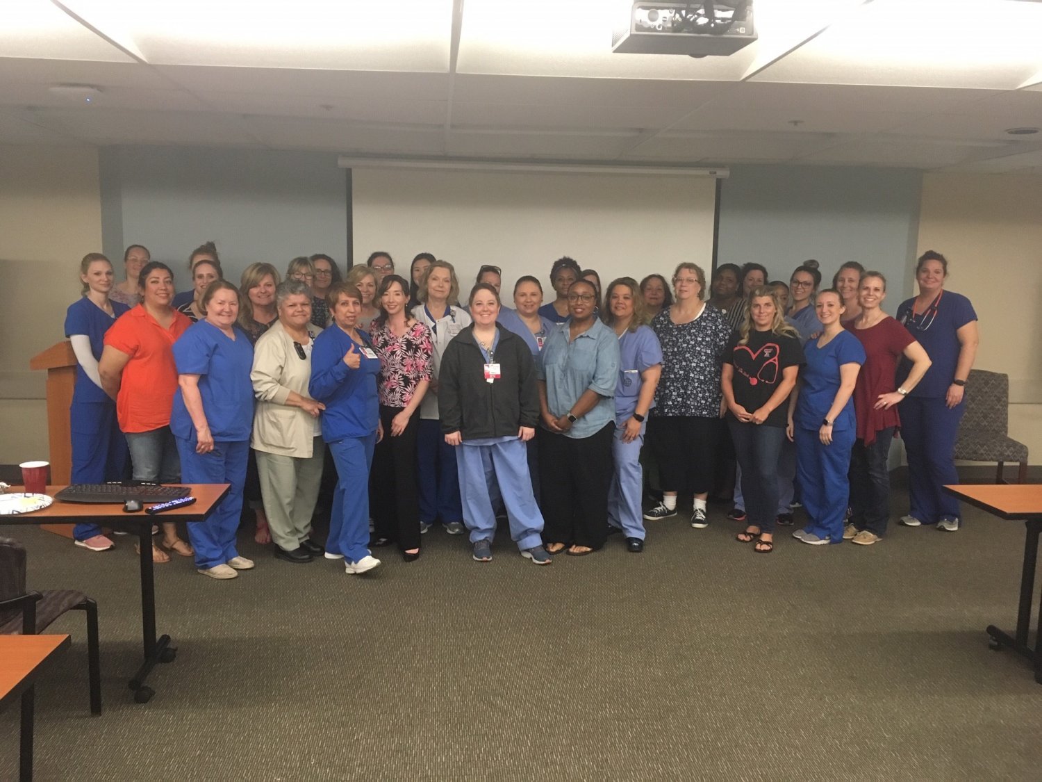 Nurses and other hospital staff in a large group