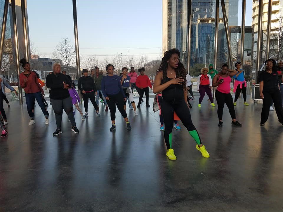 Woman leading group exercise class