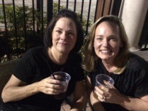 Two women sitting on a patio