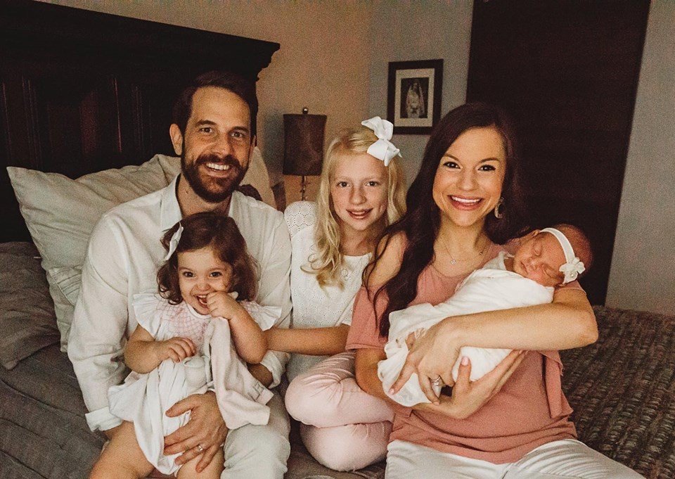Mother, father and three young daughters