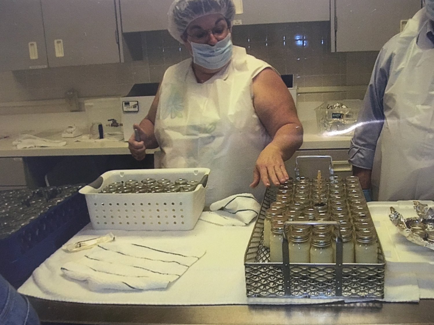 Woman working in breastmilk pasteurization lab