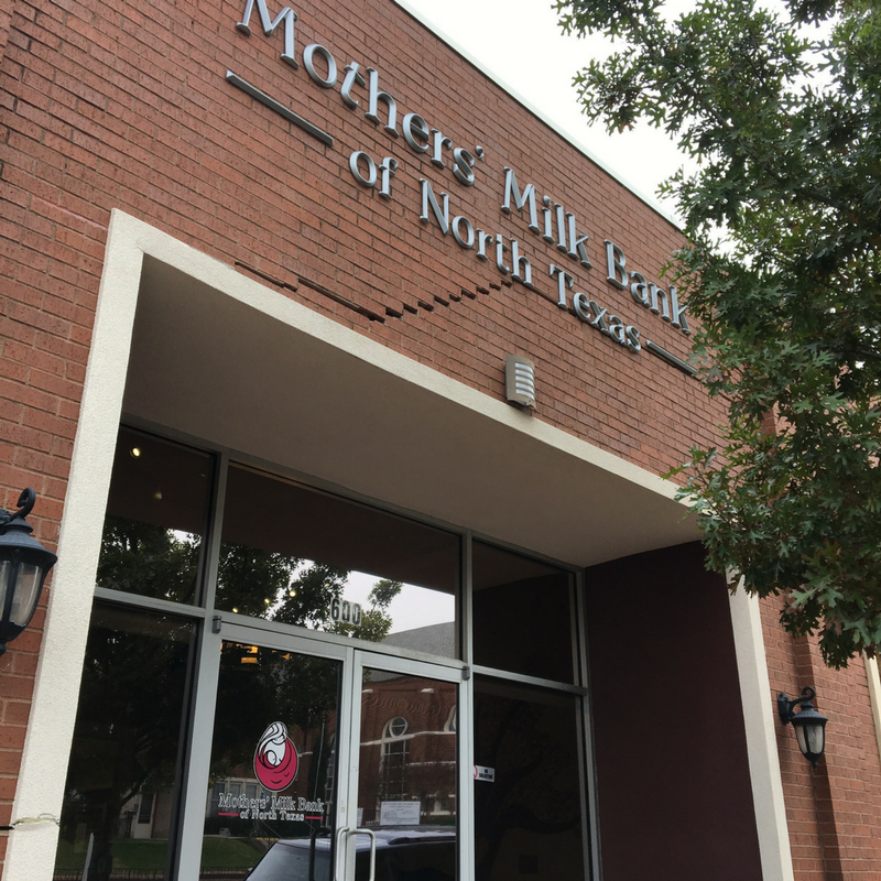 Exterior of one-story red brick office building