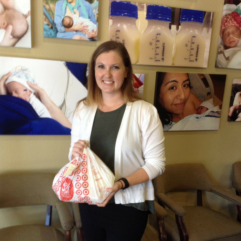 Woman holding bag of her donated milk