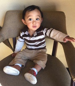 Boy toddler sitting in chair