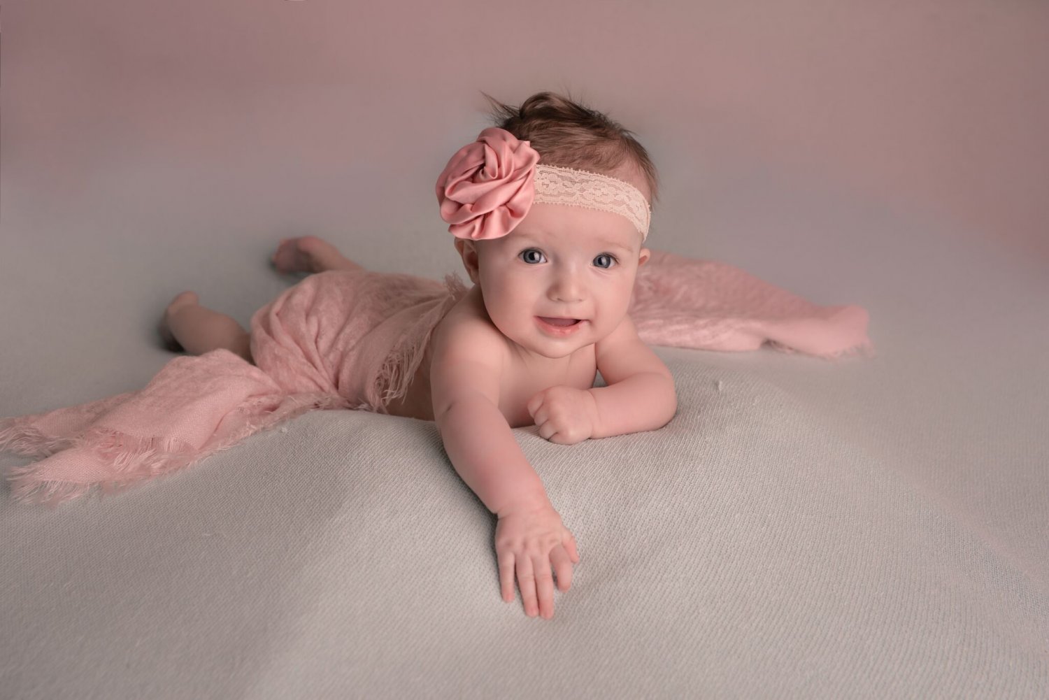 Baby girl on photo backdrop