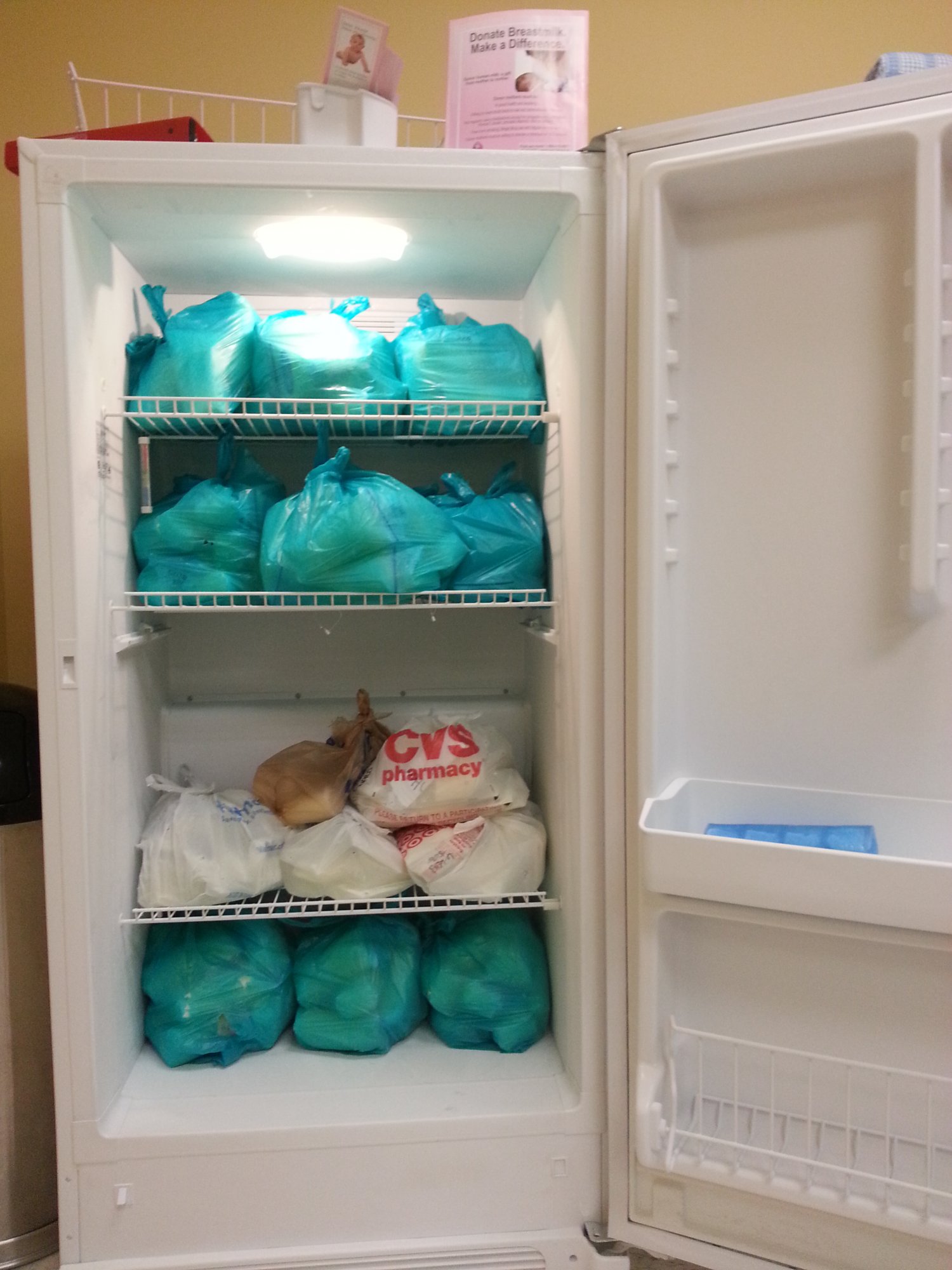 Freezer filled with bags of frozen breastmilk