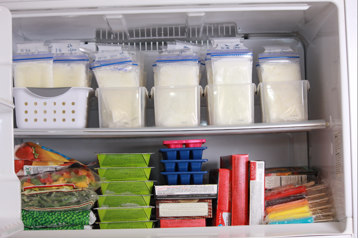 Freezer containing food, as well as bags of pumped breastmilk
