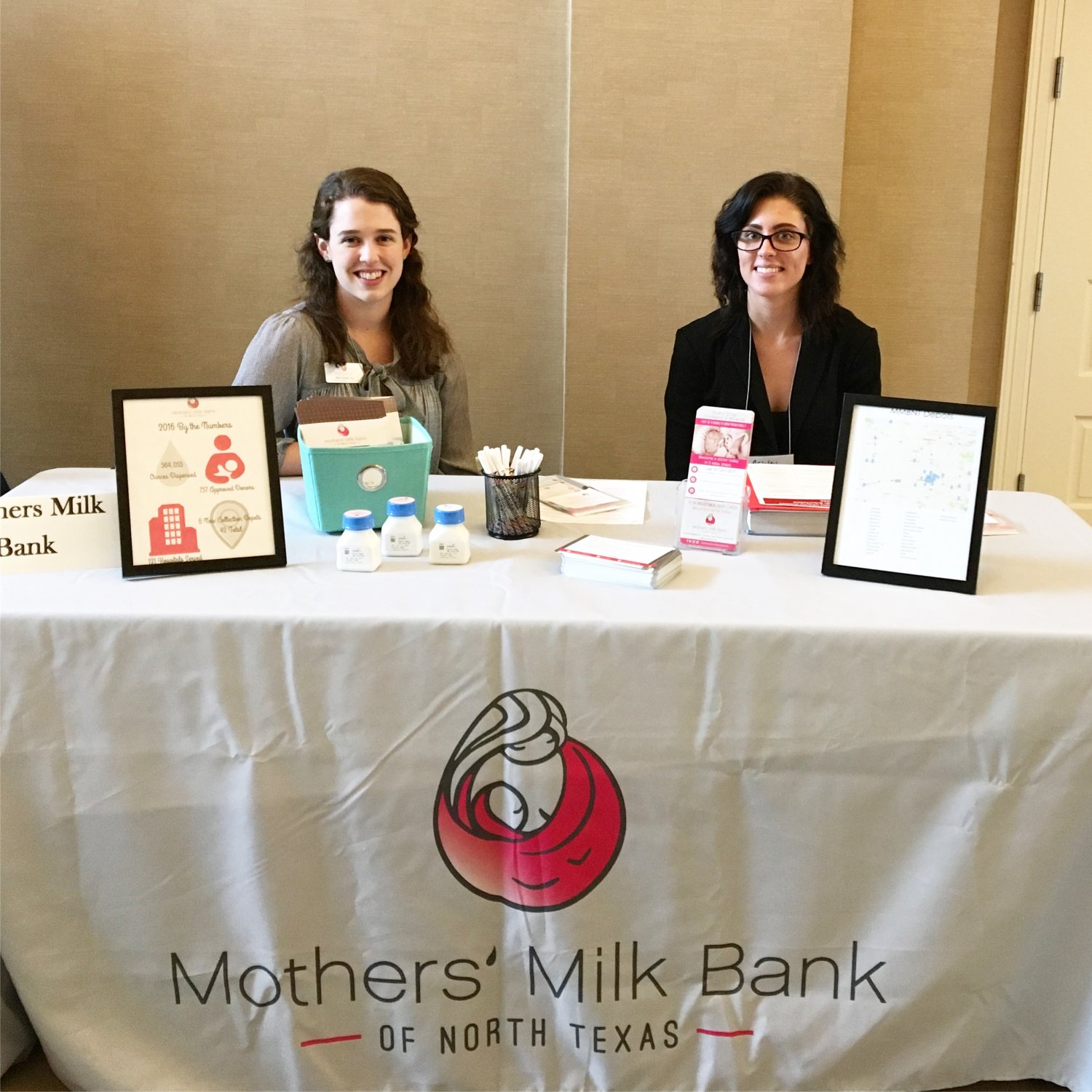 Milk bank staff sitting at informational table