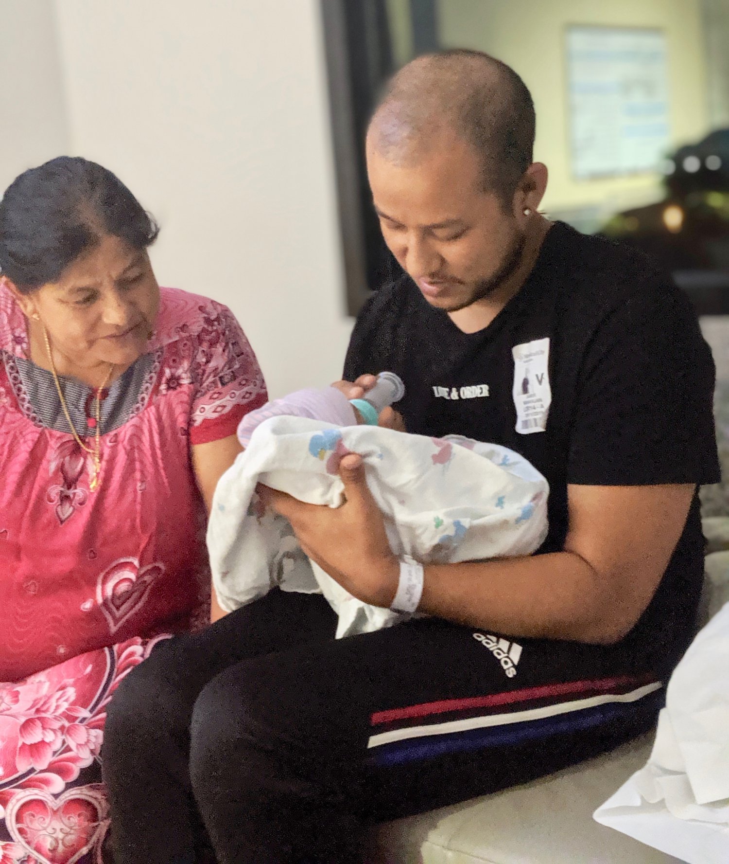 Jayden with his daddy and grandma