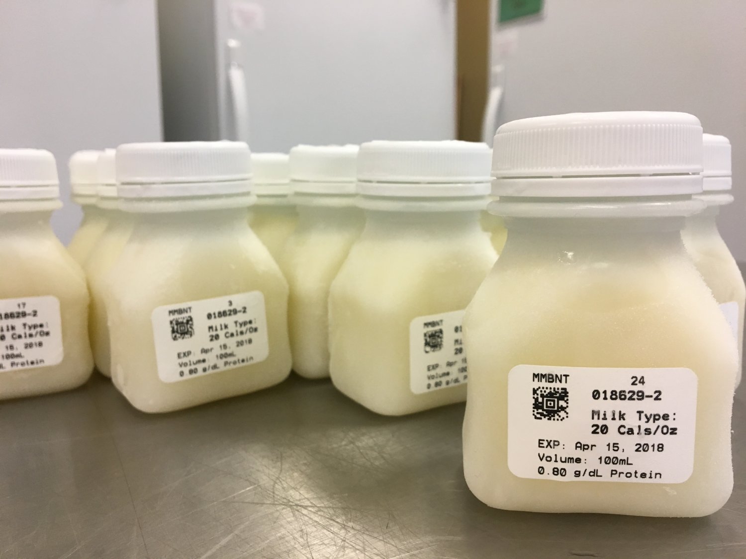 Frozen 100mL bottles of pasteurized donor human milk