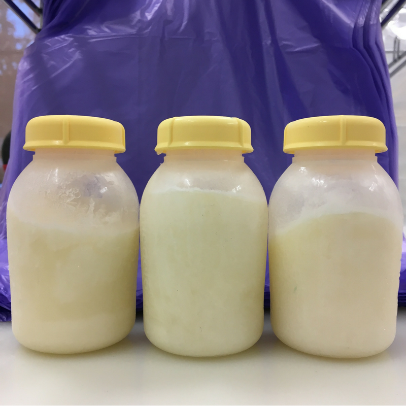 Three bottles of frozen breastmilk