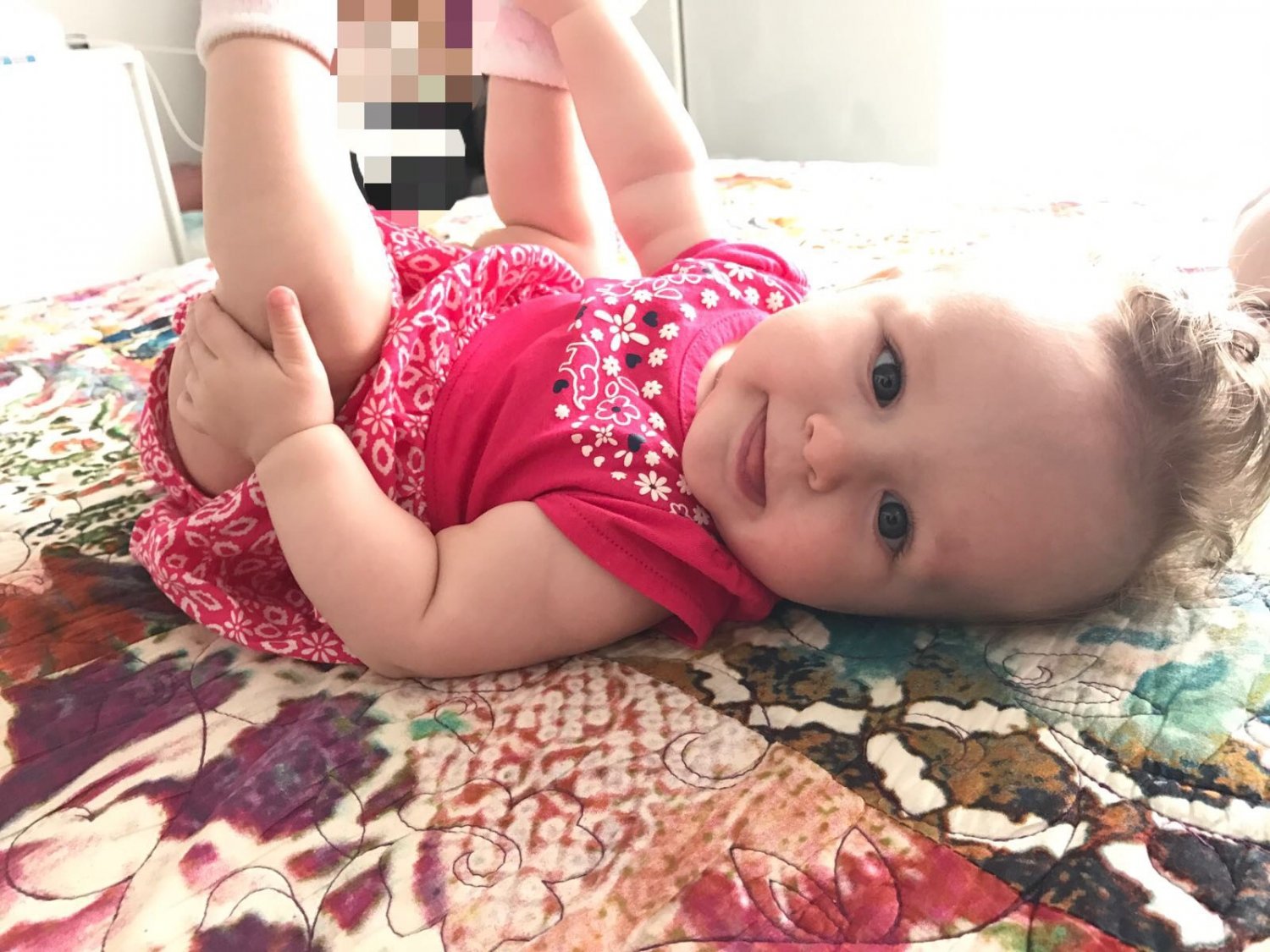 Baby laying on blanket