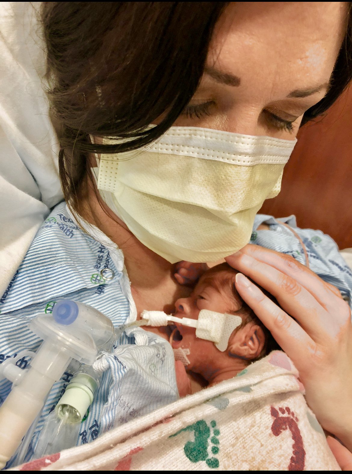 Jennifer holding Myles in the NICU.