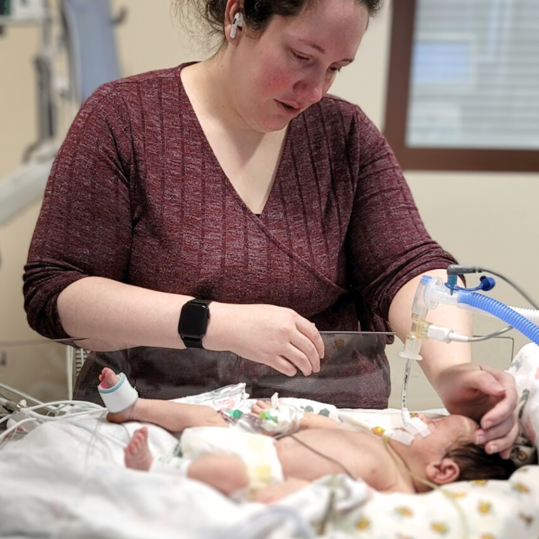 Caio and Becky in NICU, preparing to be airlifted.