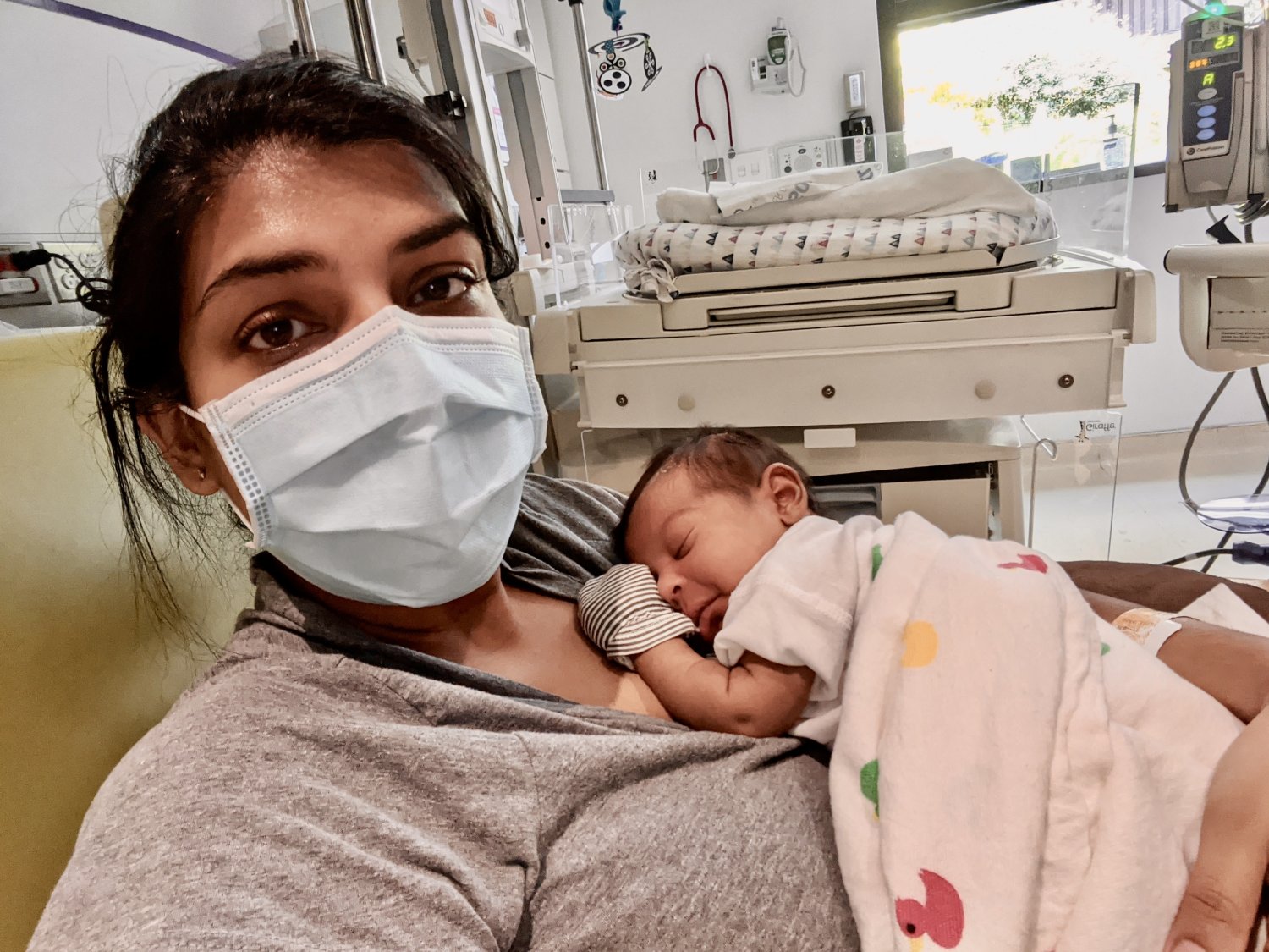 Verda holding Noor in the NICU.