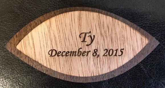 Wooden commemorative leaf engraved with baby's name and birth date