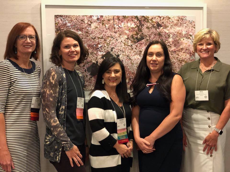 Five women at a conference