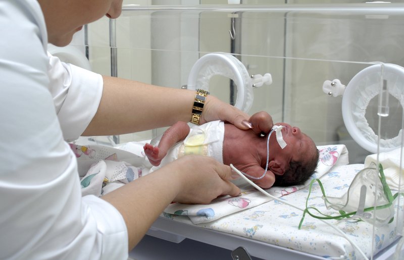 Premature infant in incubator