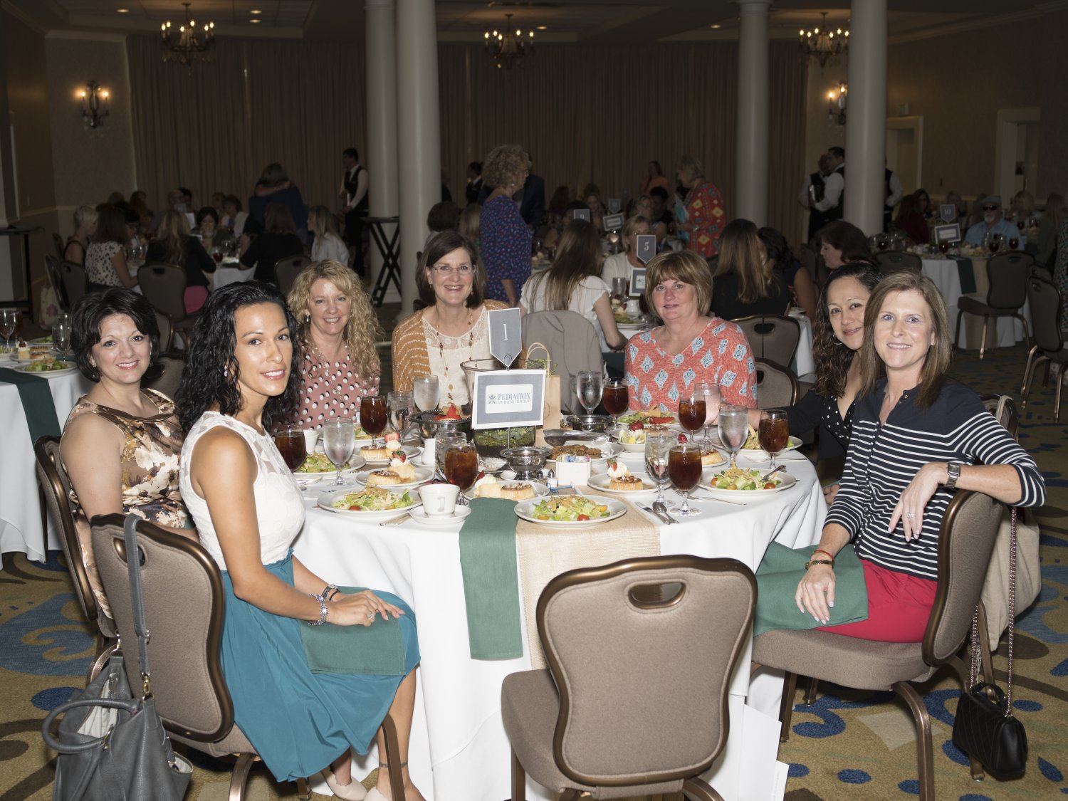 Luncheon guests sitting at table