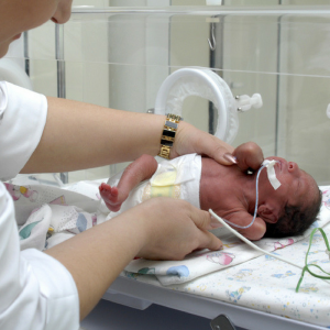 Premature infant in incubator