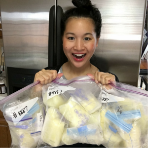 Mother holding bags of her frozen breastmilk